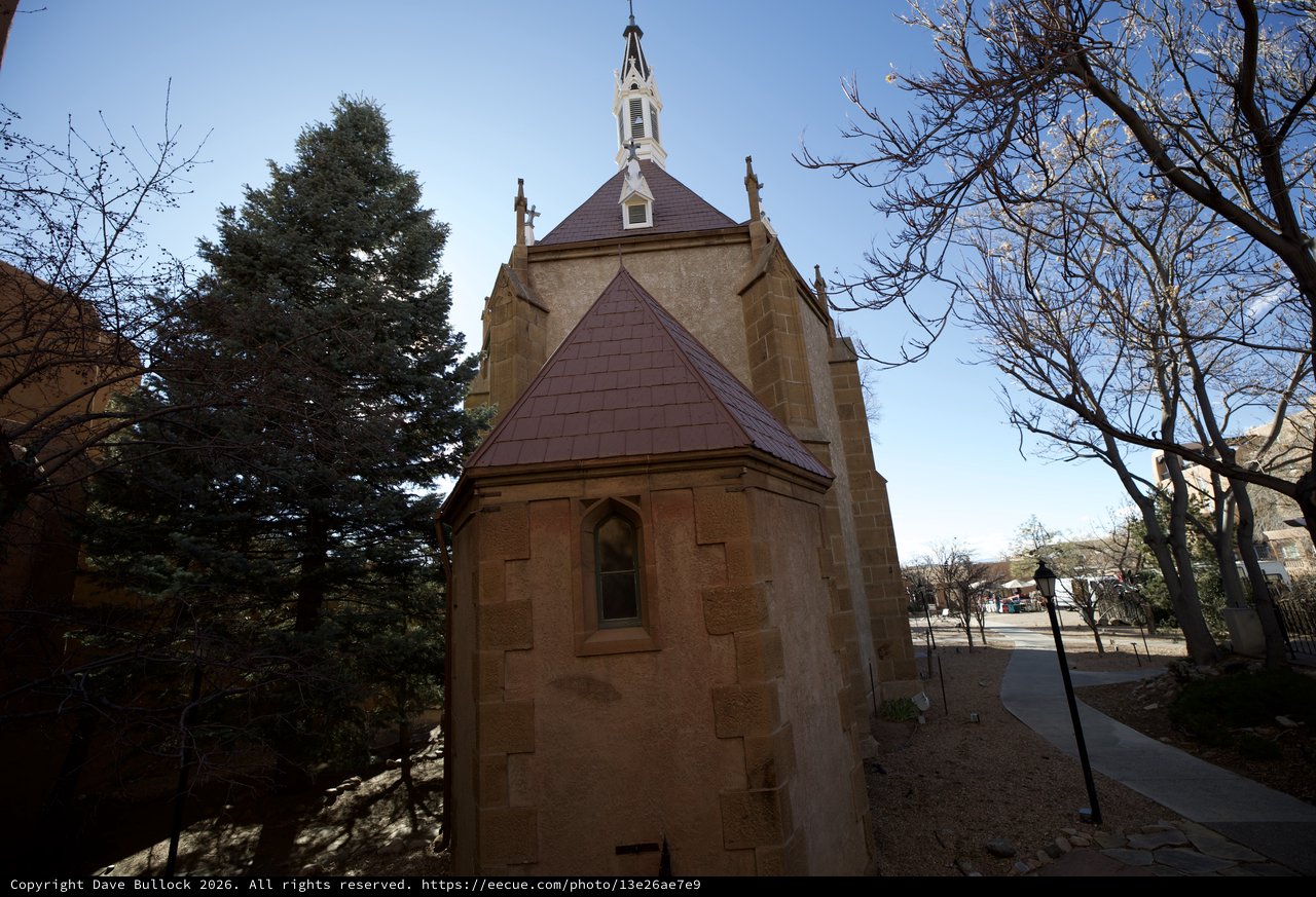 Historic Stone Chapel with Purple Roof and Bell Tower