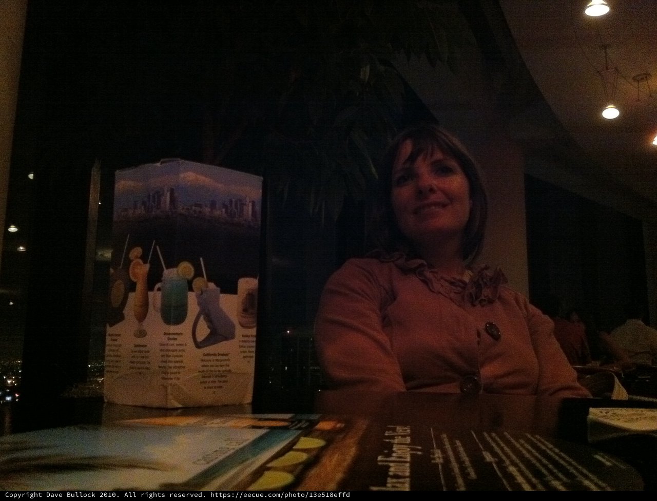 Evening Smile at a Dimly Lit Restaurant
