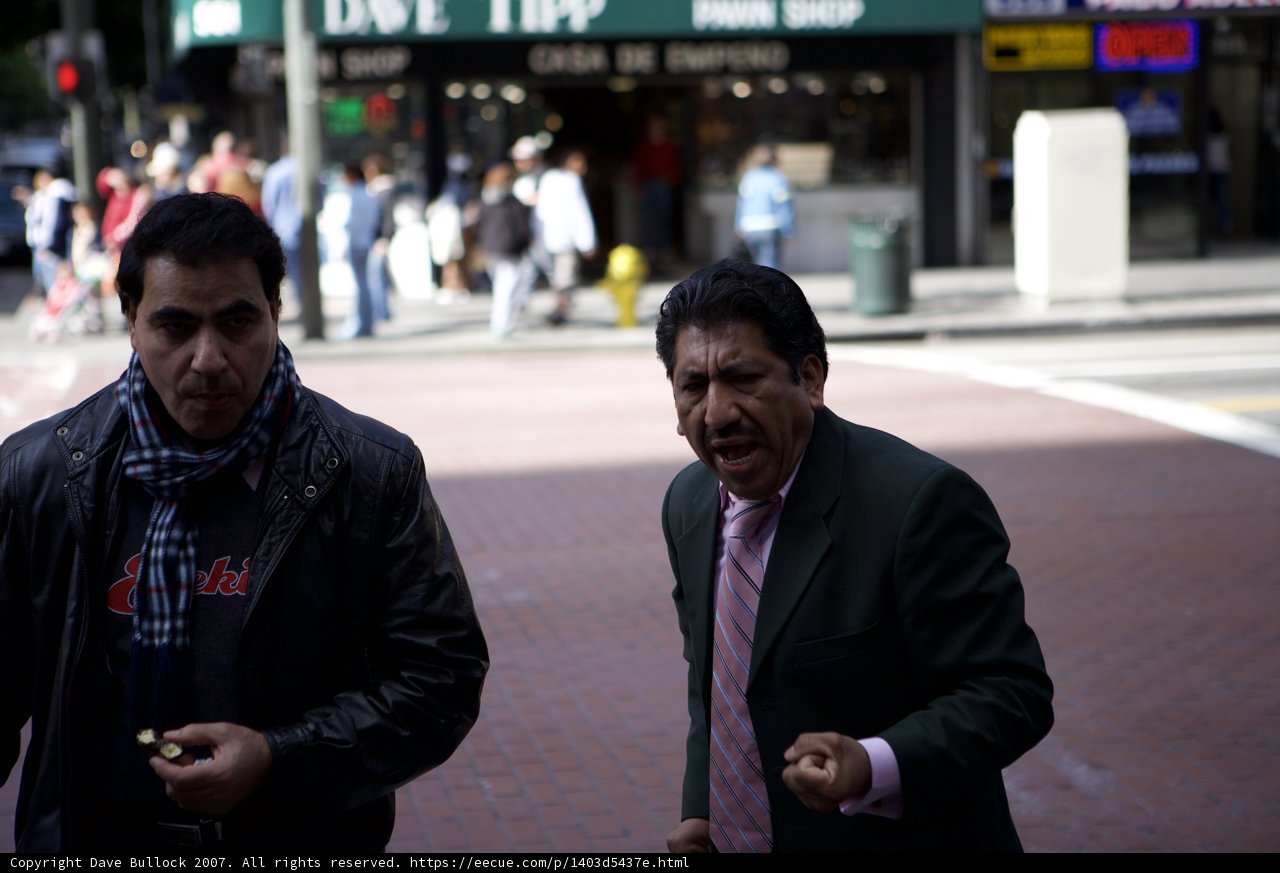 Two Men in Formal Wear Walking Down the Sidewalk