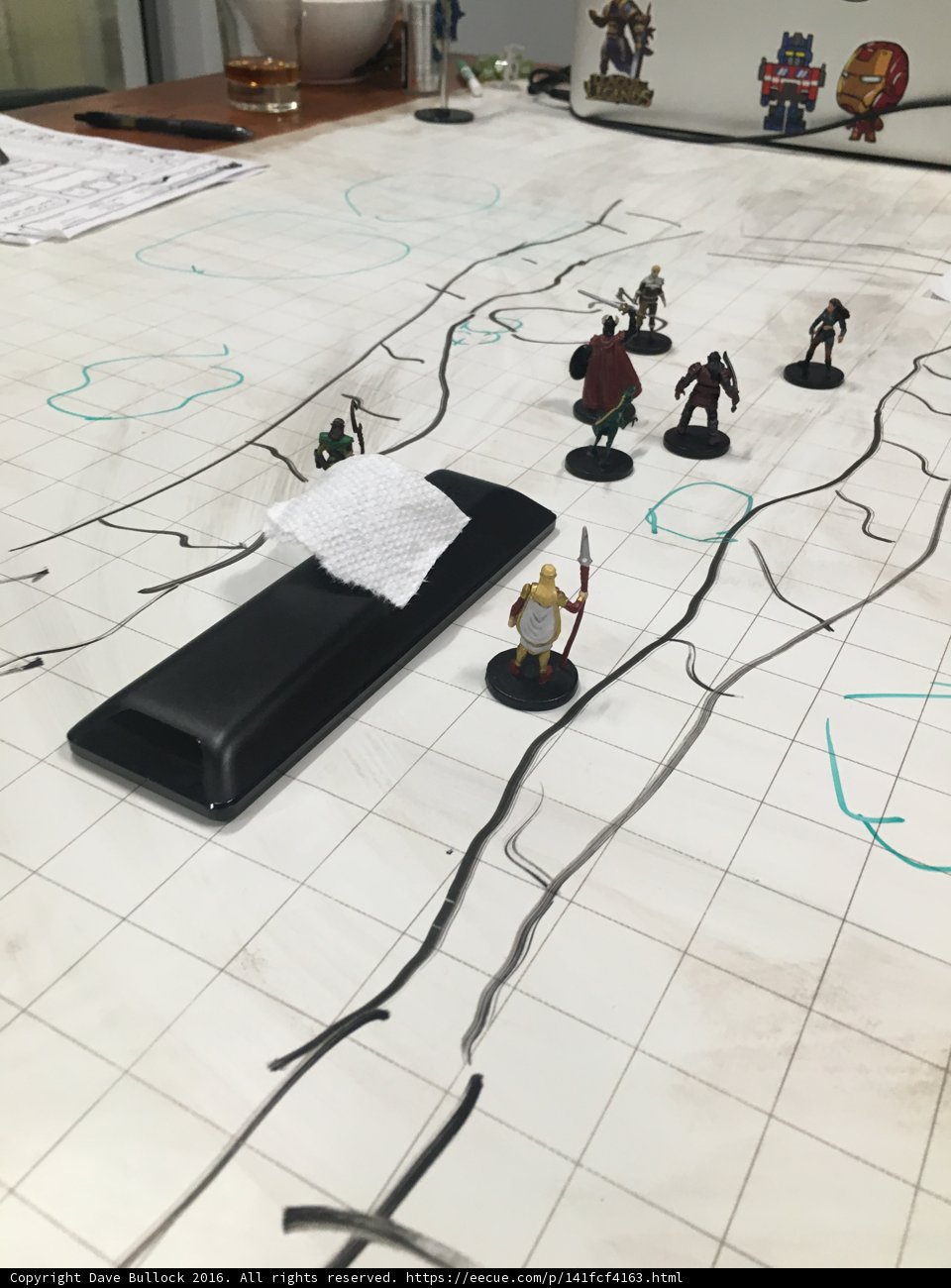 Miniature Warriors Plan Battle Strategies using a Map