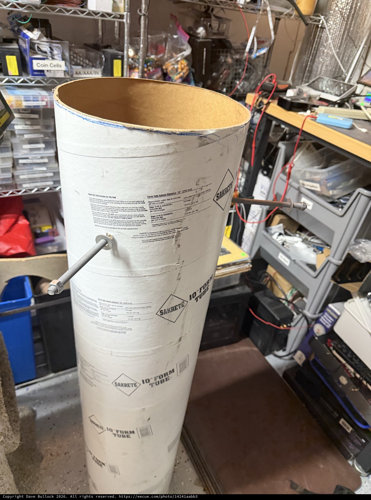 Industrial Cardboard Form Tube in Cluttered Workshop