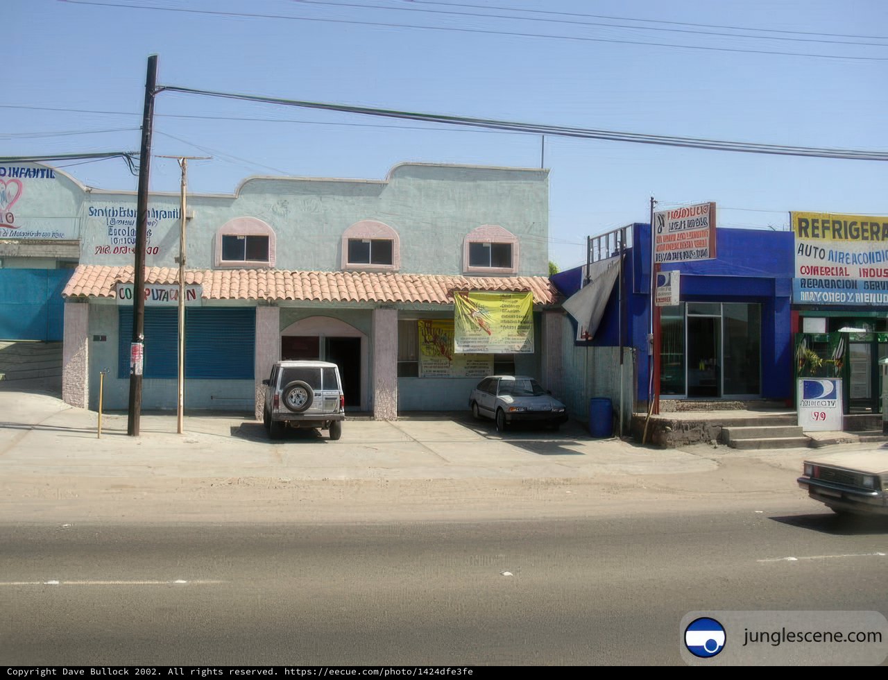 Blue Building with Parked Car
