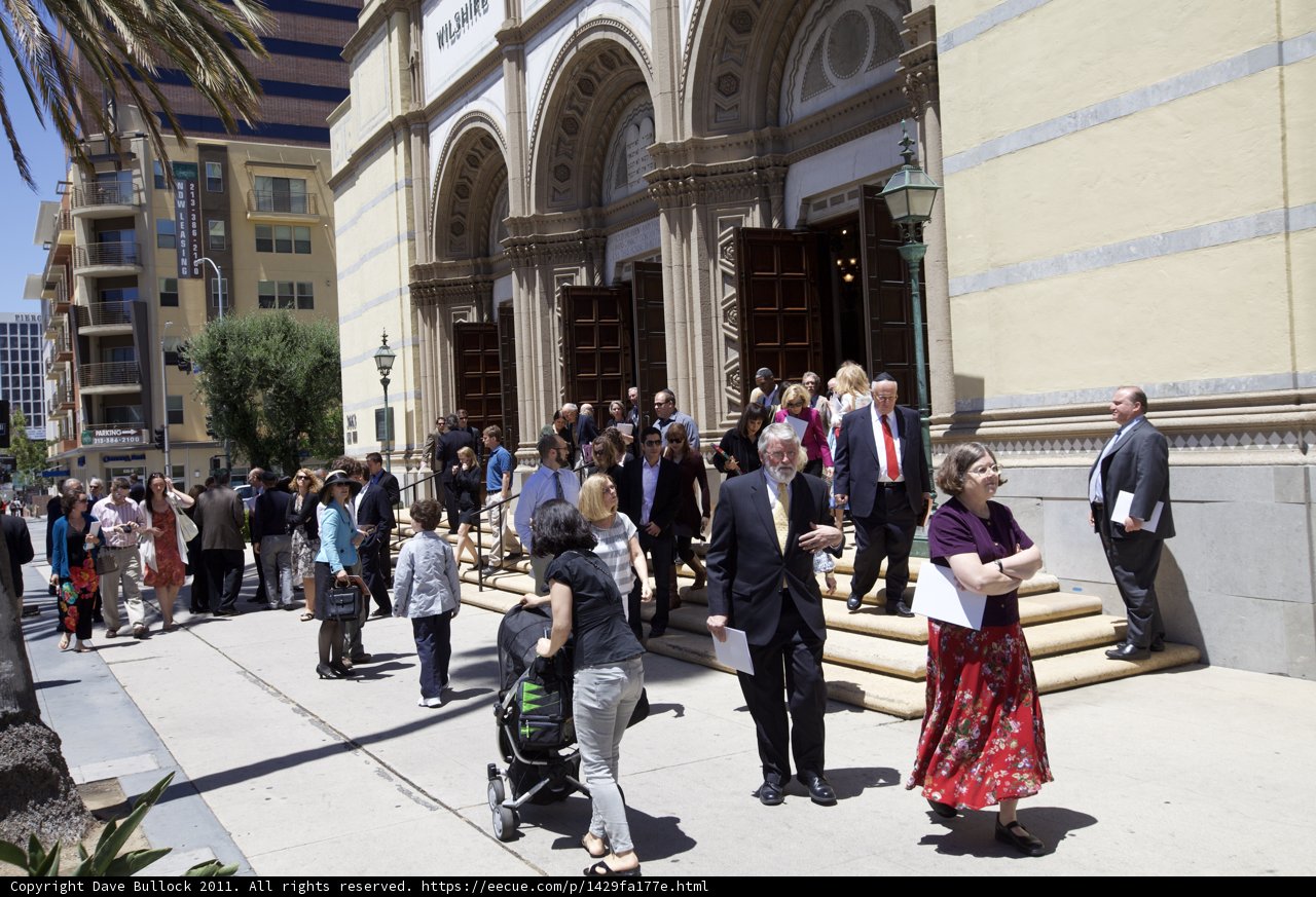 Group of Ordained Individuals Standing Outside of Building