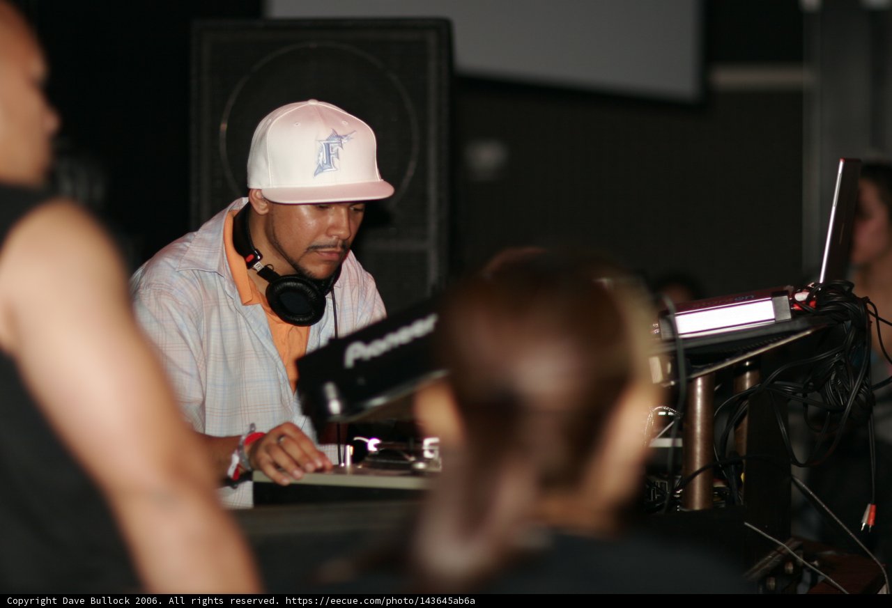 DJ Craze Entertains with Headphones and Turntable