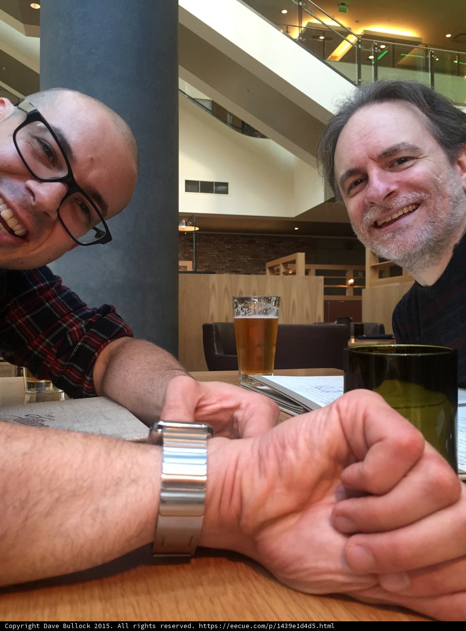 Friends Fist Bump Over Beers