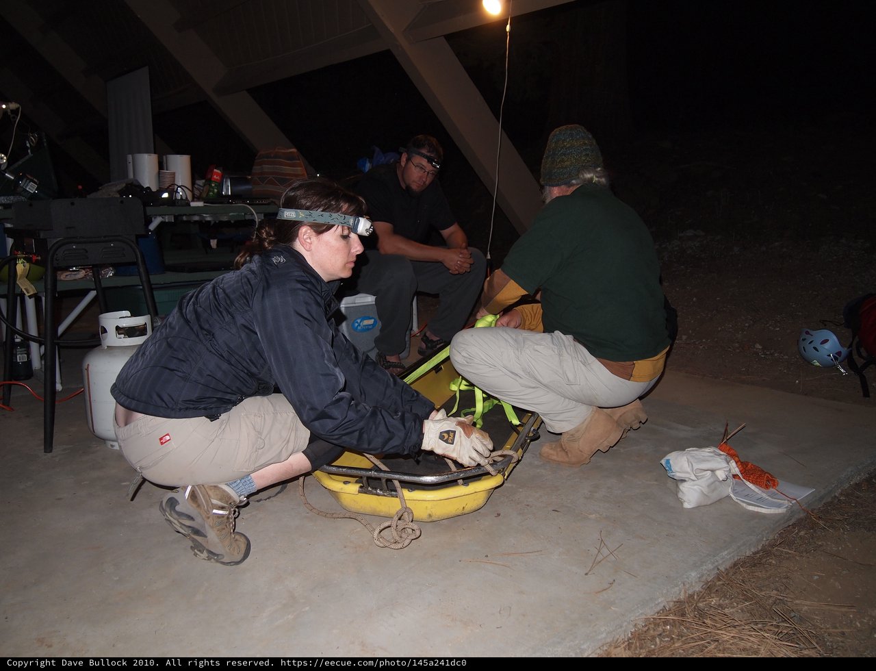 Night Rescue Team Prepares Stretcher for Operation