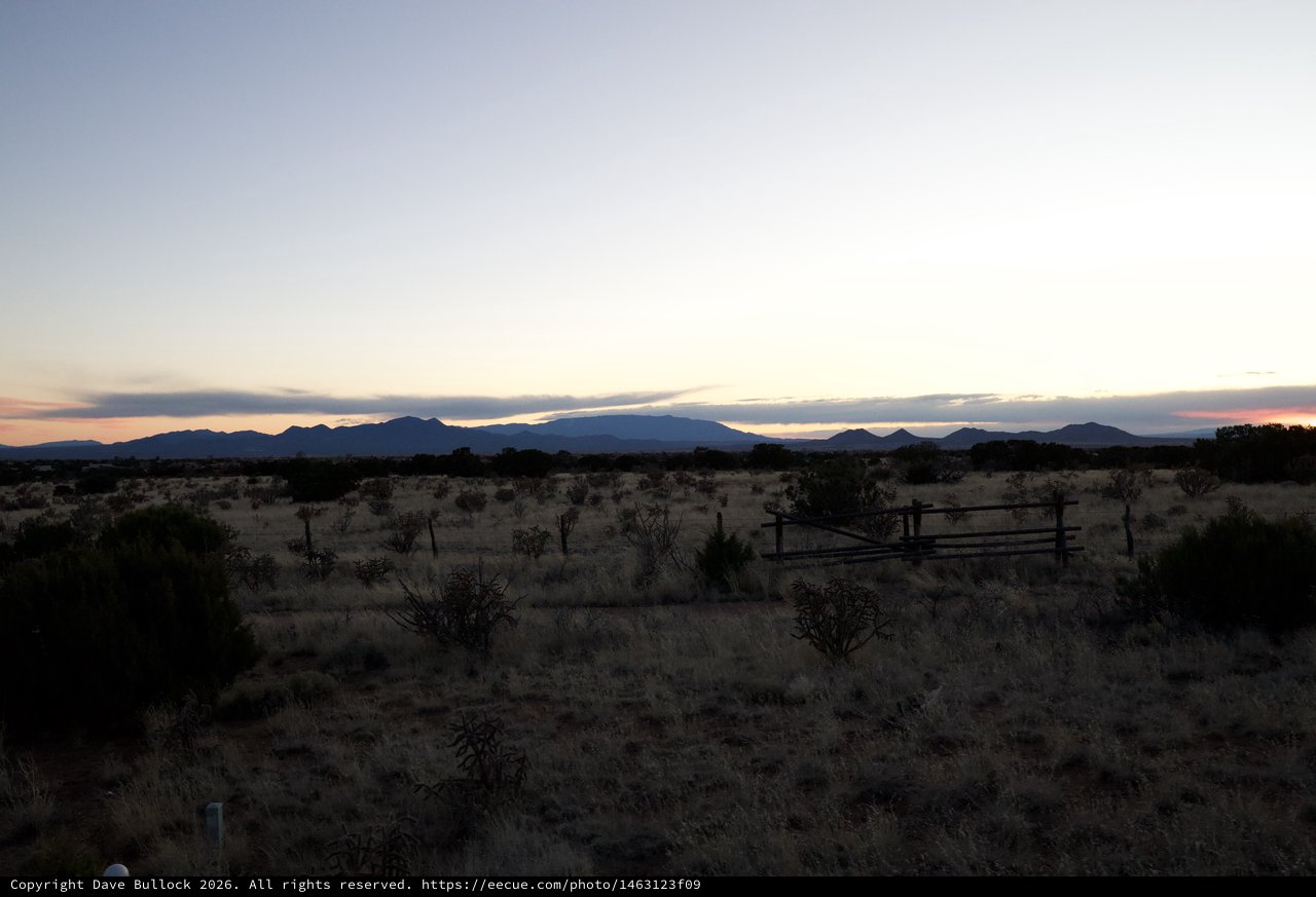 Desert Twilight Over Distant Mountain Ranges