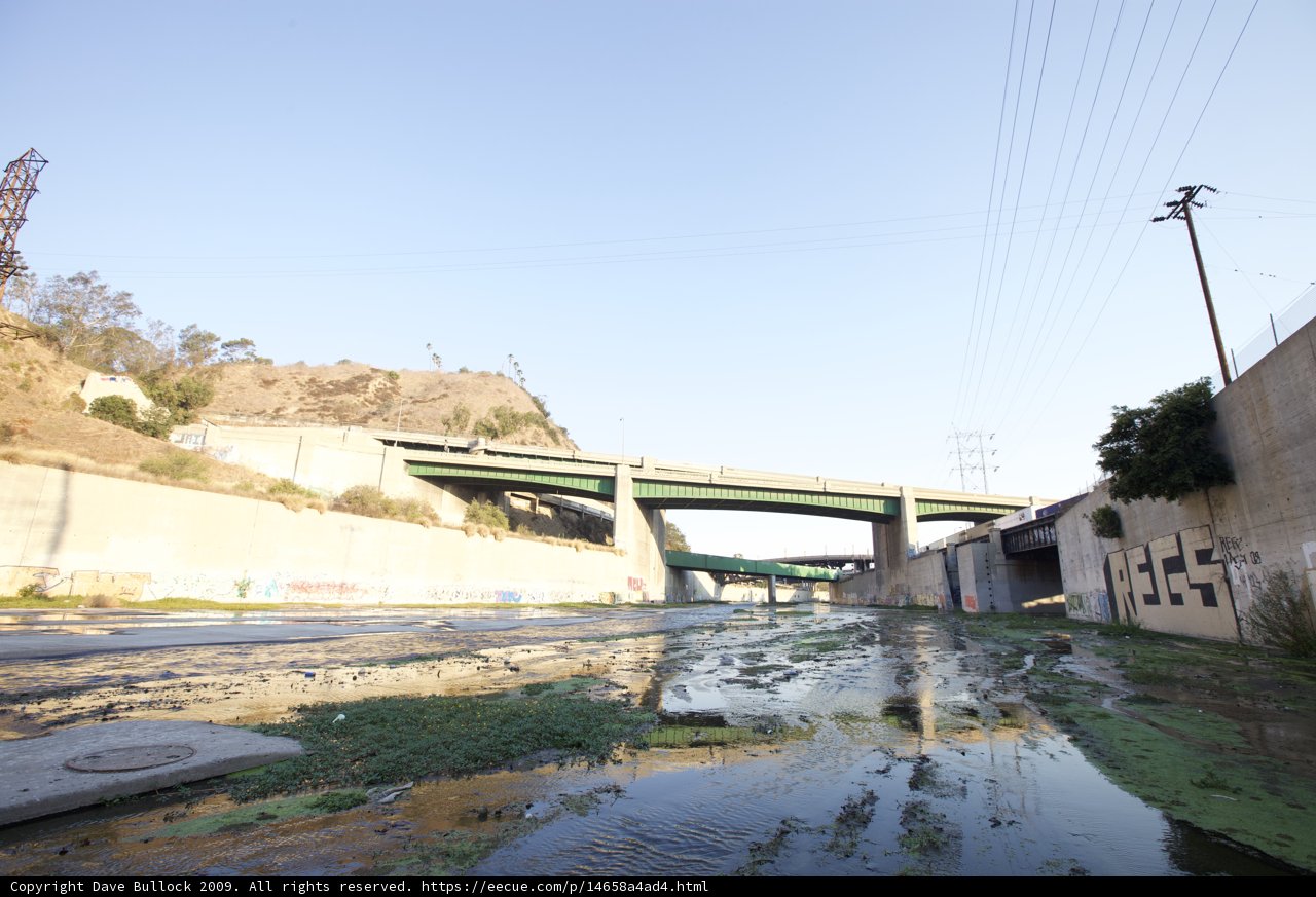 Overpass over a Road with a Puddle