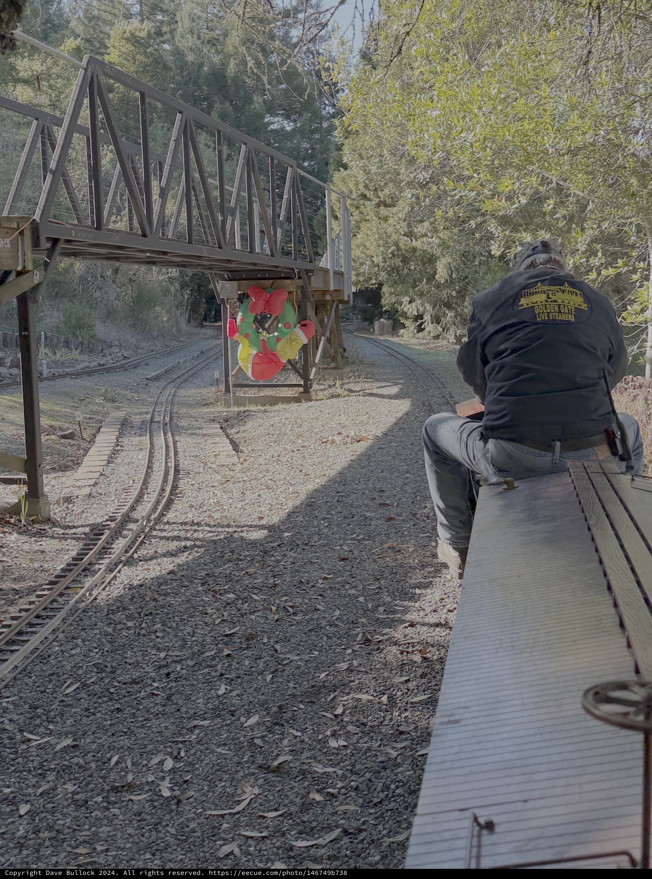 Railway Worker Maintaining Historic Railroad Bridge