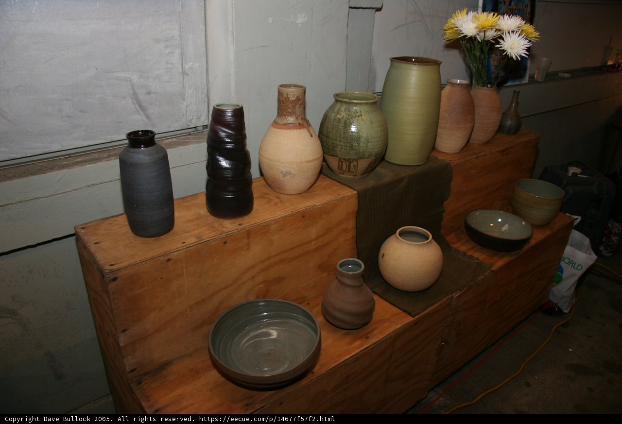 Myriad of Vases on a Wooden Shelf
