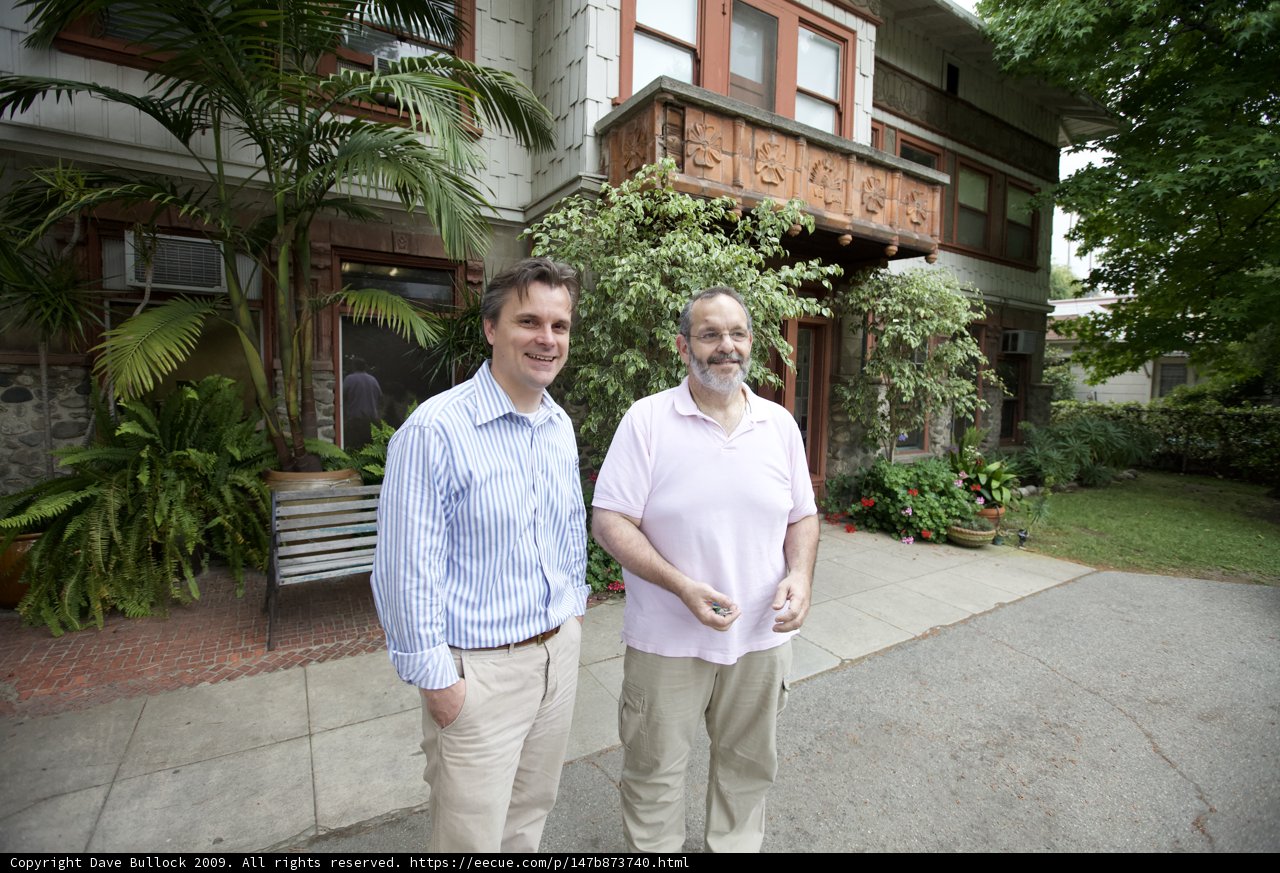 Two Men in Front of a Decorative House