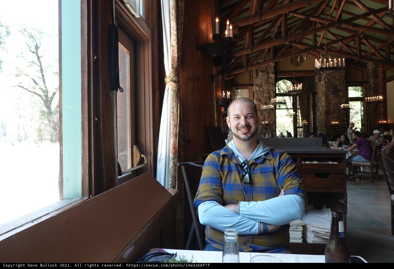 Man Relaxing in Rustic Restaurant Setting