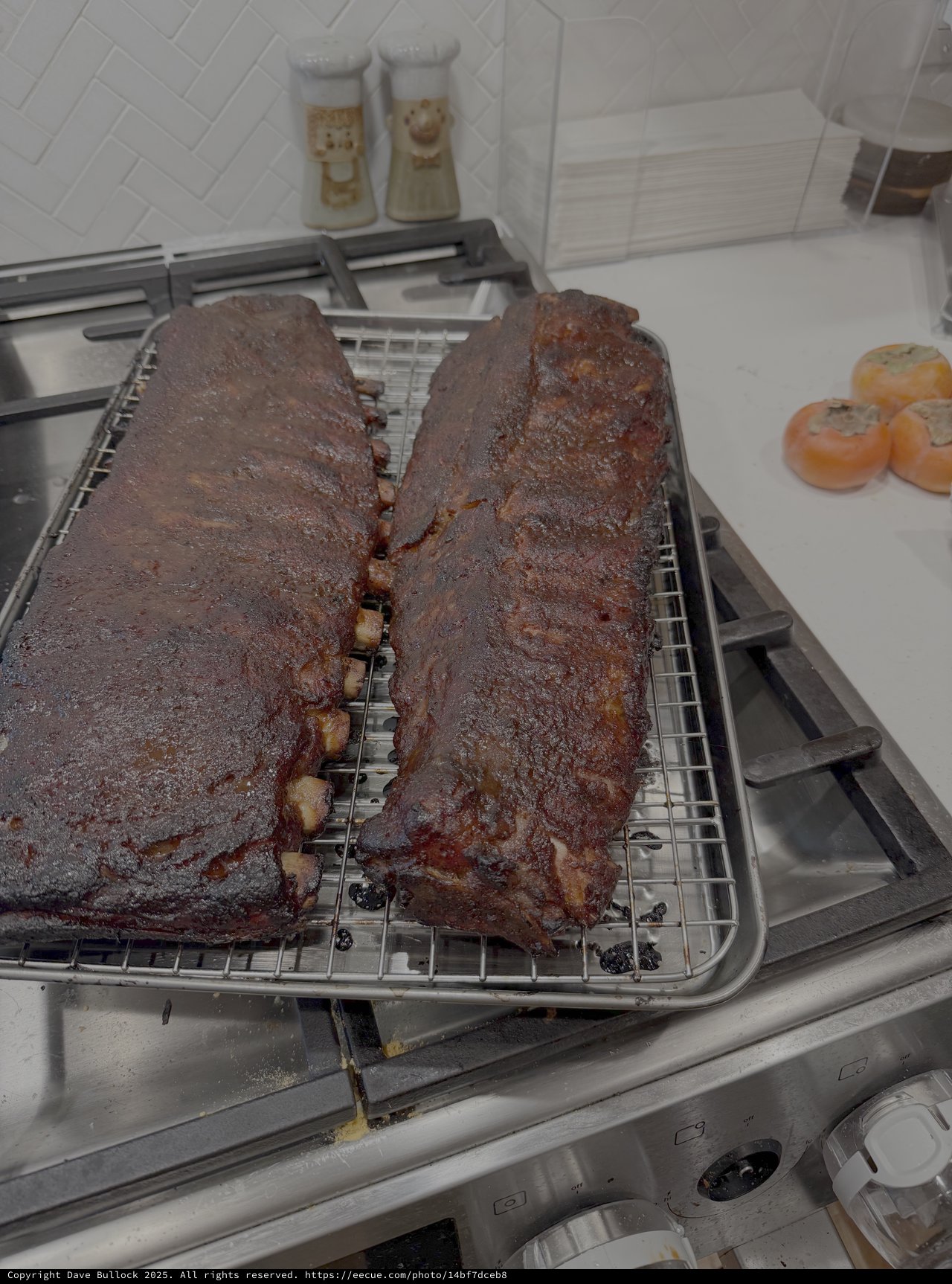 Overcooked BBQ Ribs Cooling on Kitchen Rack