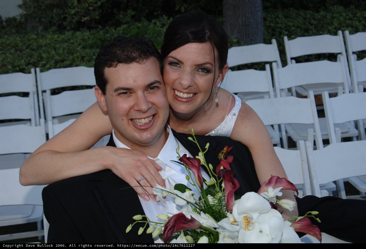 Joyful Newlyweds Embrace at Outdoor Wedding Ceremony