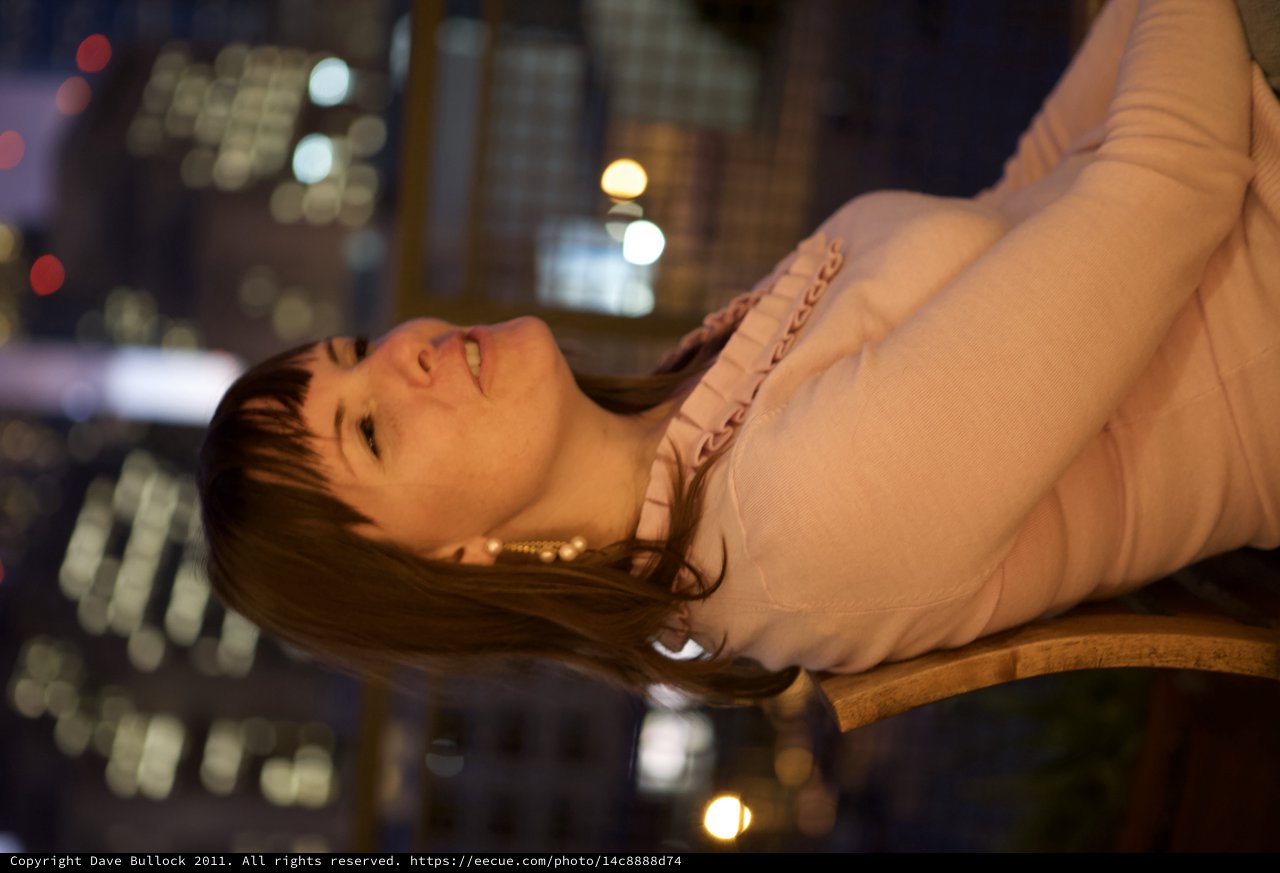 Penelope Gazing Upward Against City Night Lights