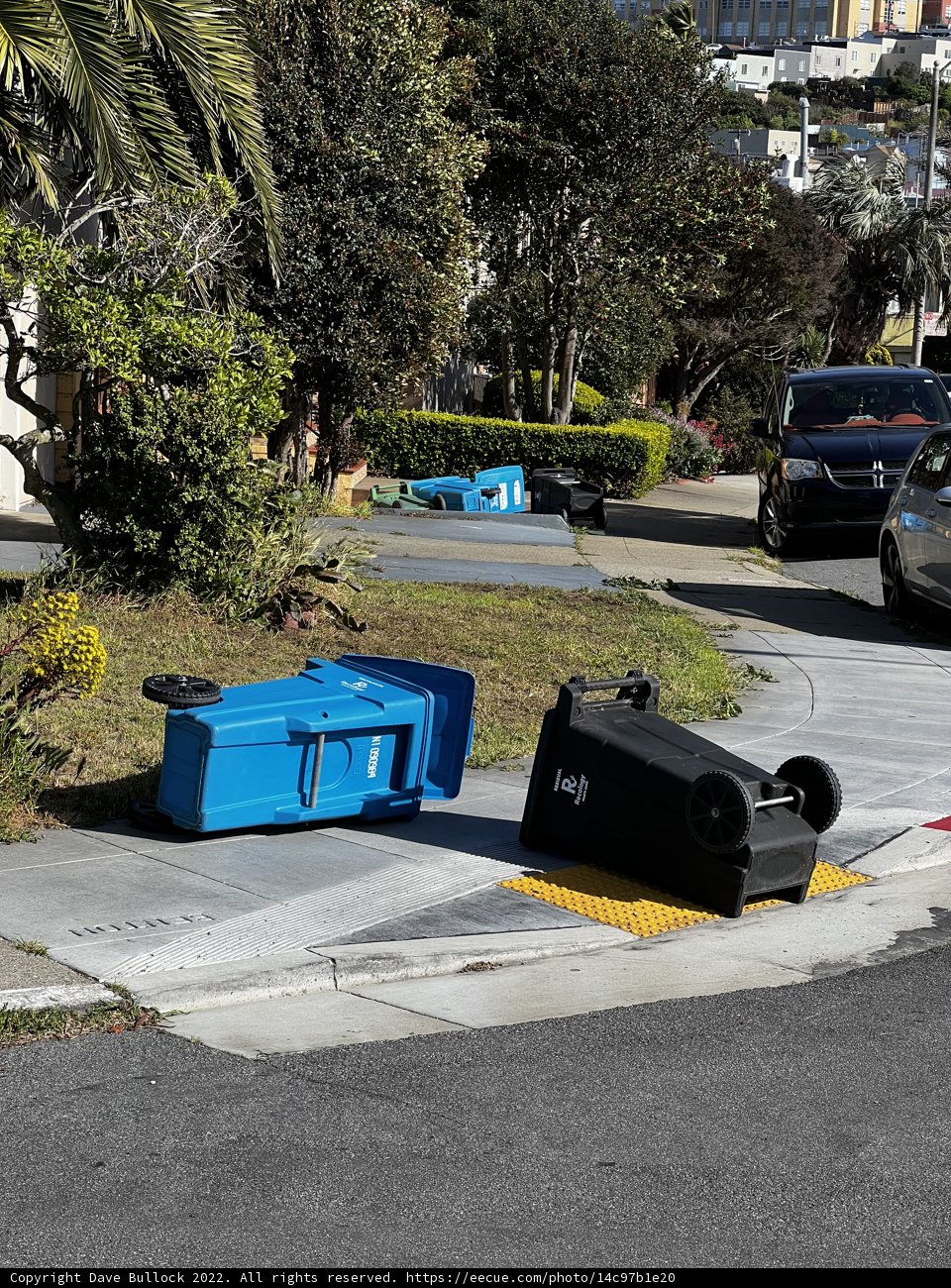 Blue Garbage Cans on a City Street