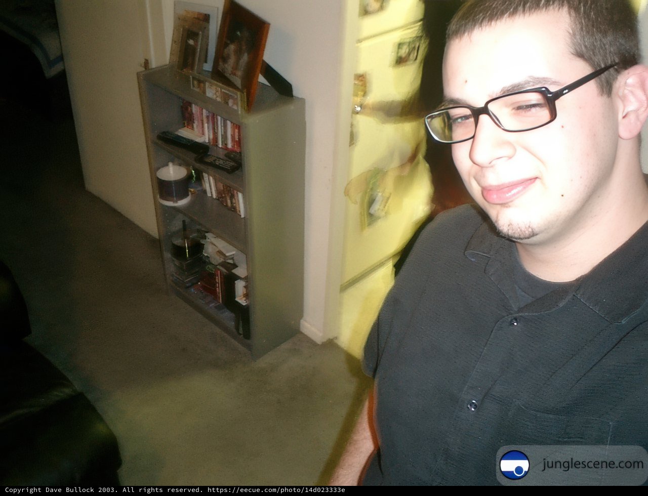 Dave B Checking Out His Bookshelf