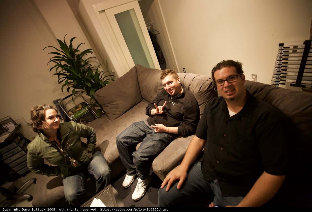 Three Men on a Cozy Living Room Couch