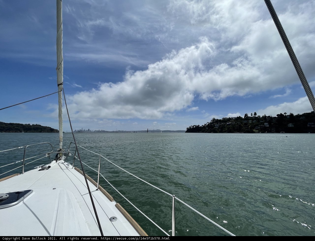 Serene Sailboats in the Cloudy Horizon