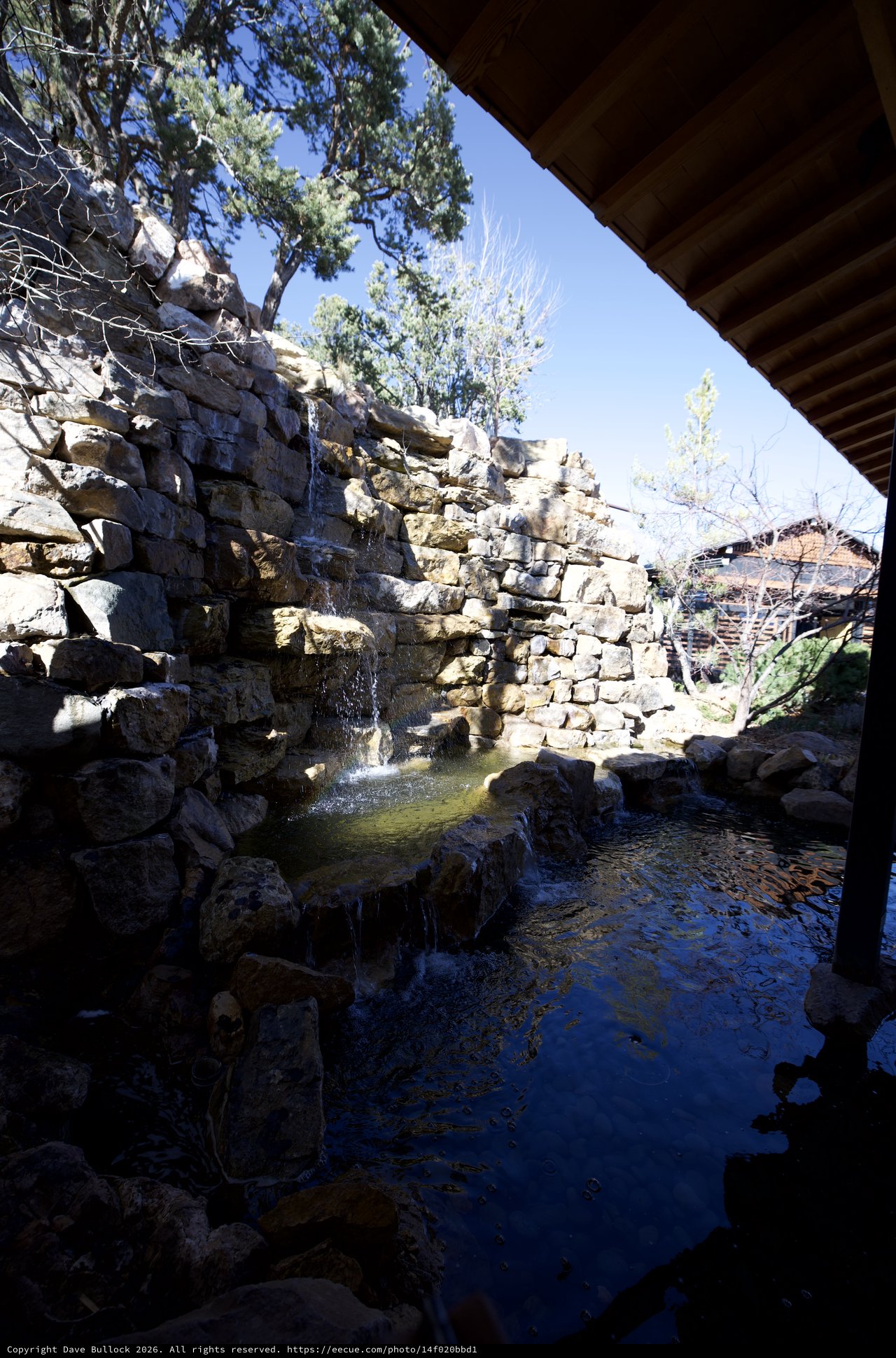 Natural Stone Waterfall and Pool in Tranquil Garden Setting