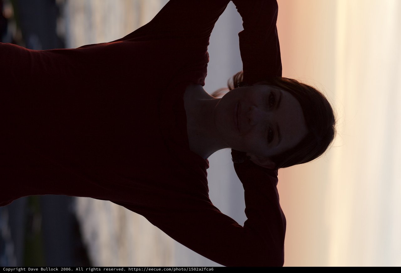 Silhouetted Woman at Golden Hour by the Sea