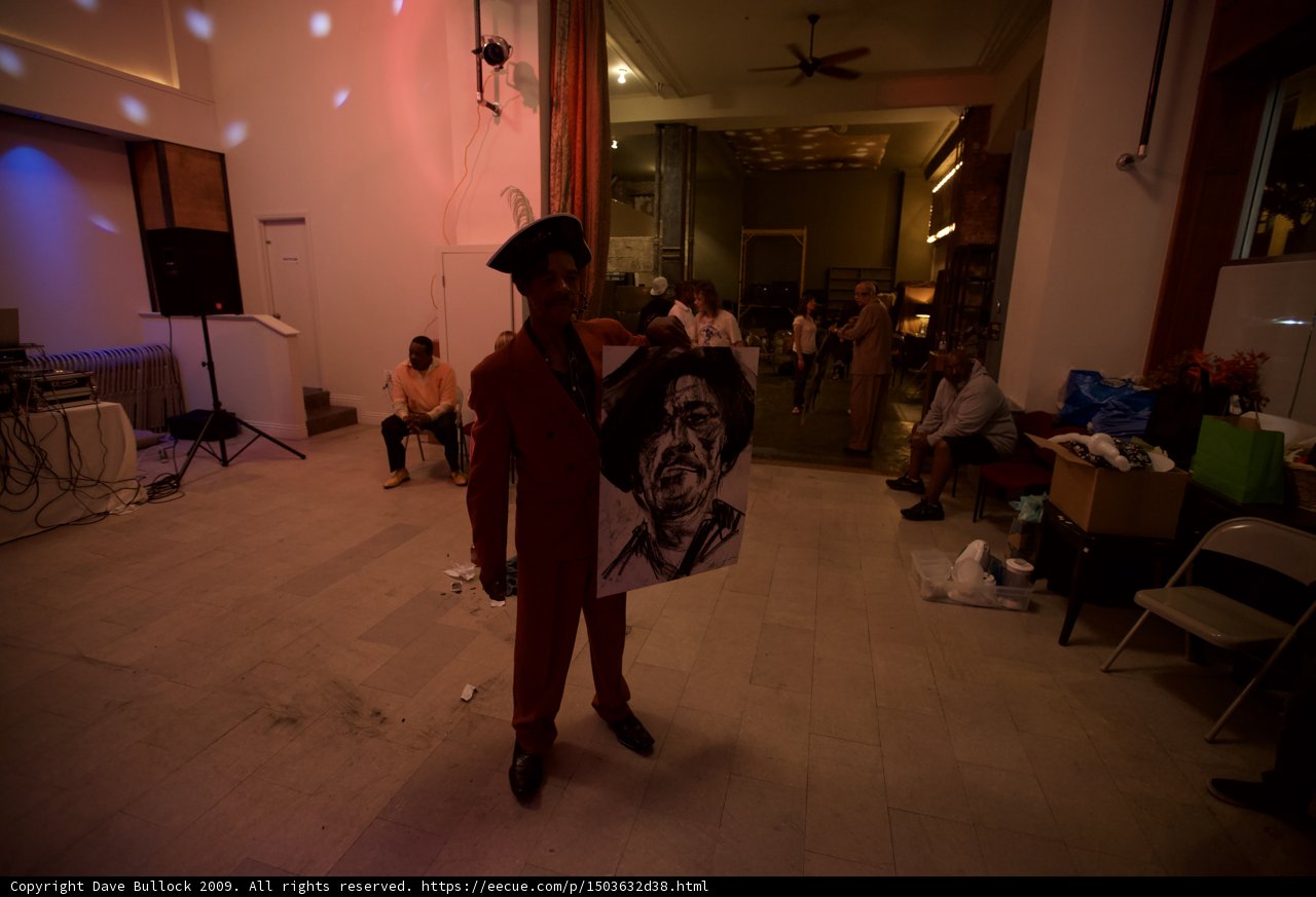 The Man in the Red Suit and His Painting