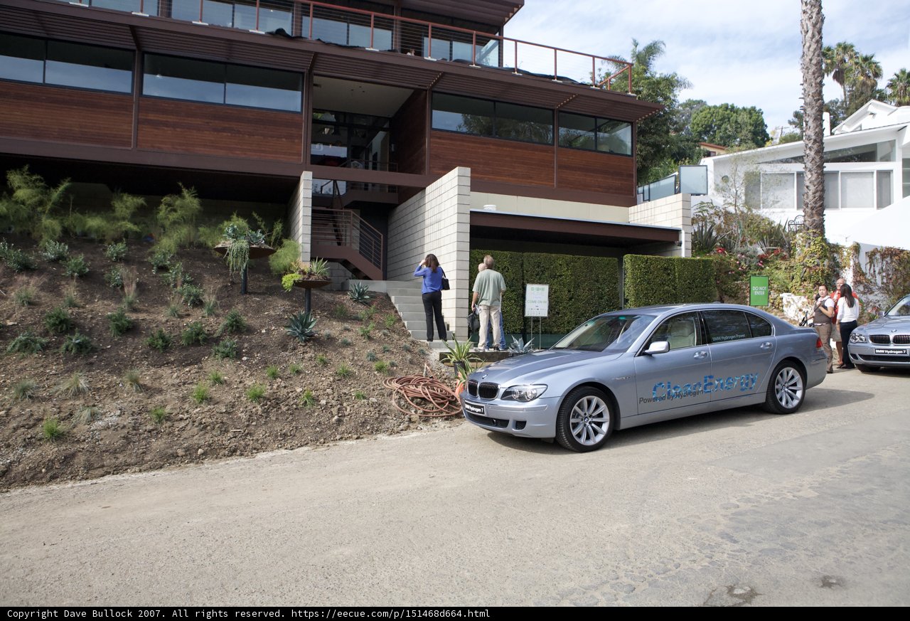 Parked BMW Coupe in Front of a Beautiful House