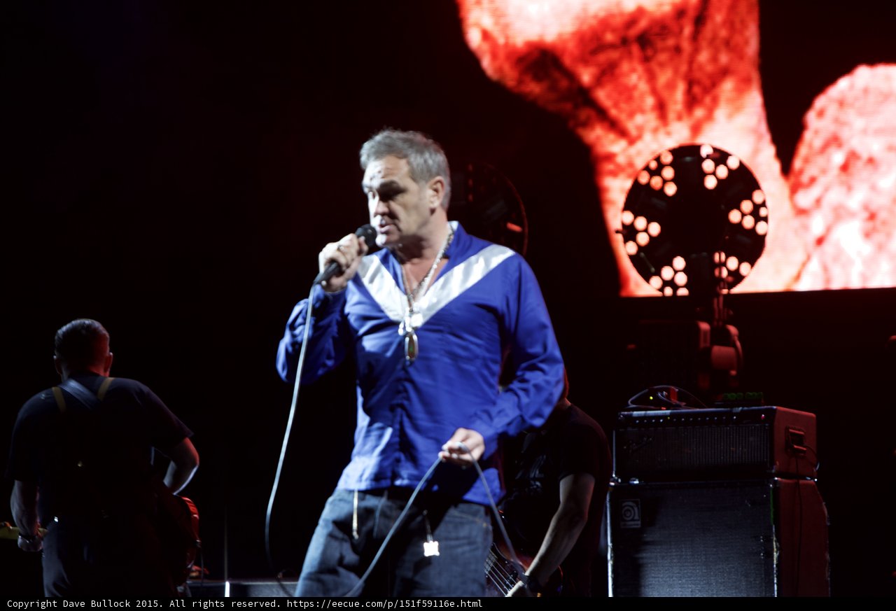 Morrissey Singing Blue Shirt Guitarist Ampeg Amp Circular Light Red Video Screen Dark