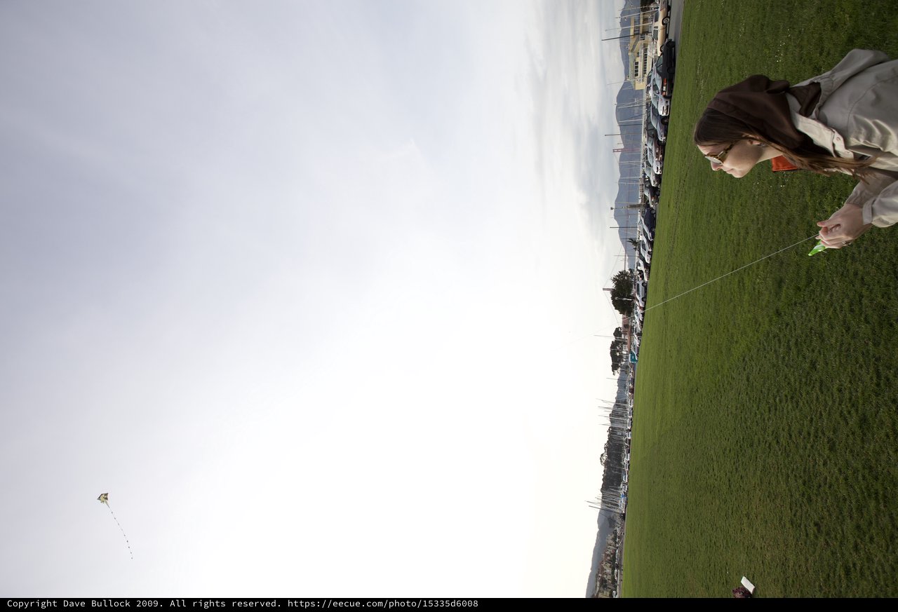 Woman Flying Kite Over San Francisco Marina Green