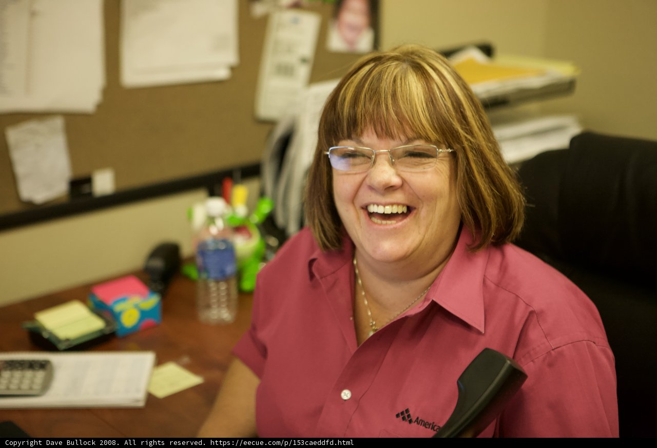 Happy Woman at her Desk