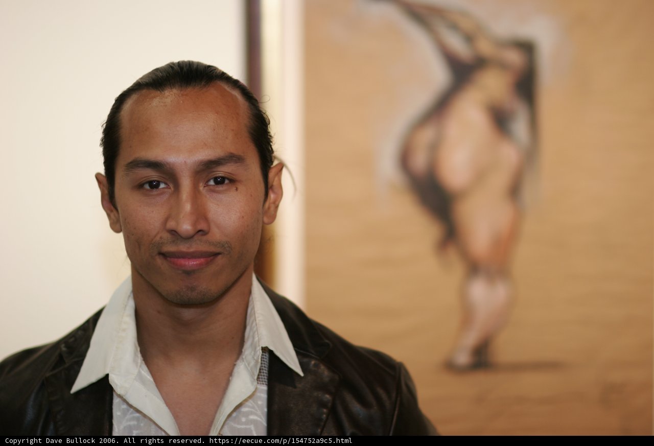 Man in Leather Jacket Admiring Painting