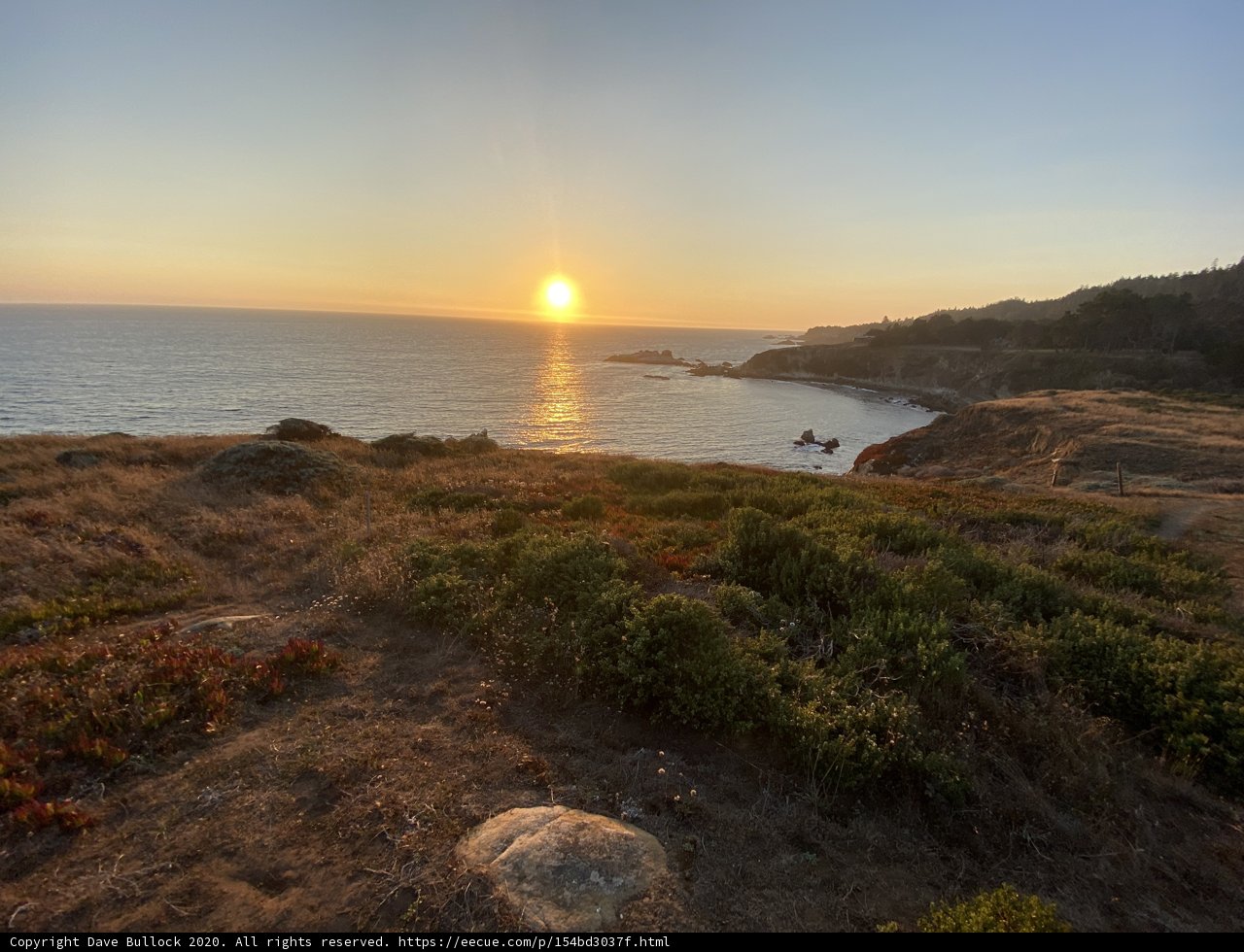 Sunset over Rocky Hillside and Ocean