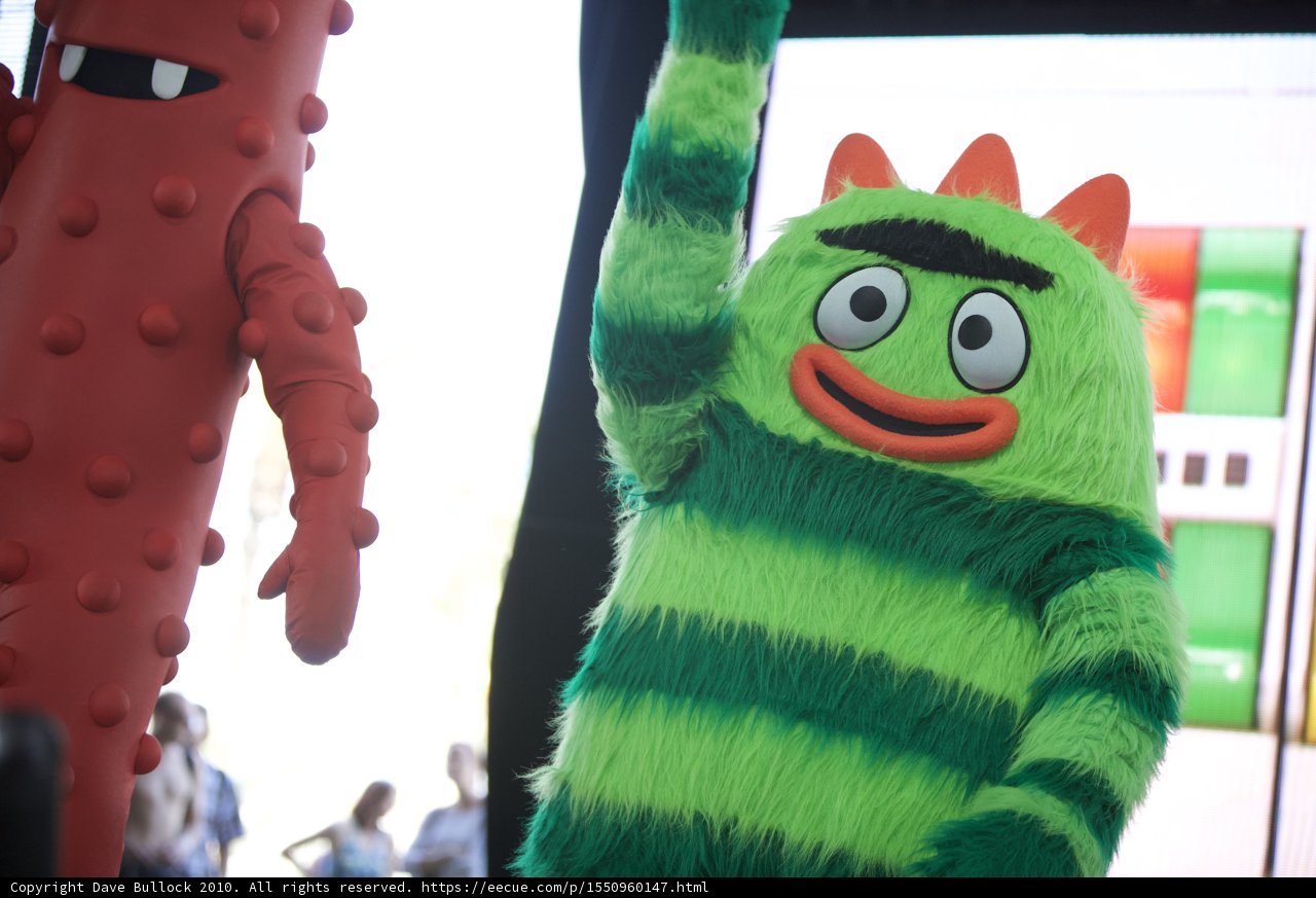 Colorful Monster Amongst Festival-Goers
