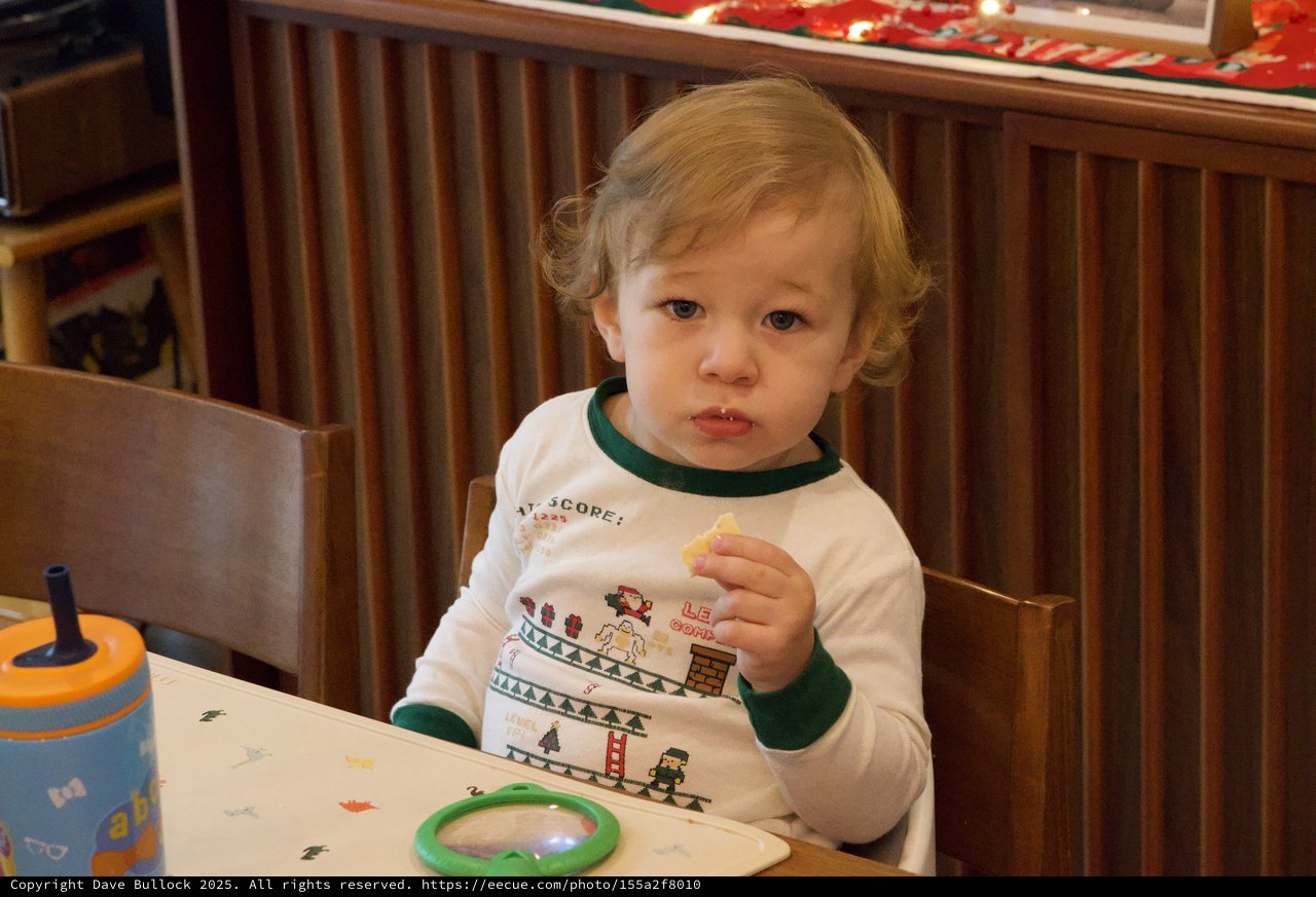 Toddler Enjoying Christmas Eve Snack at Home