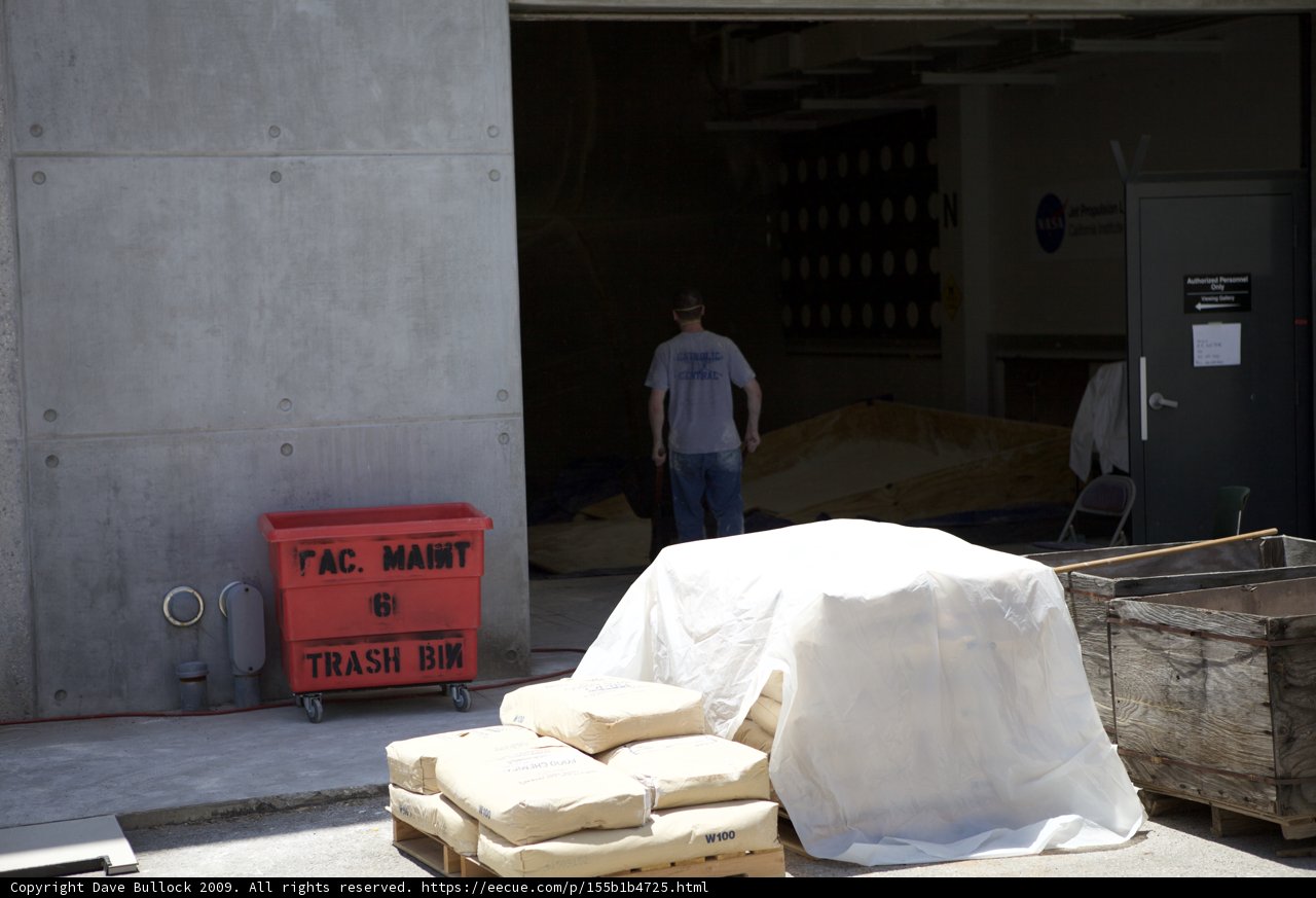 Wooden Boxes and a Standing Man