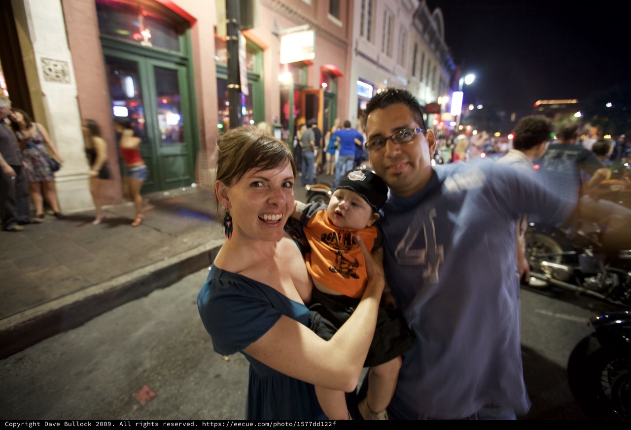 Young Family Poses on Lively Austin Street Night
