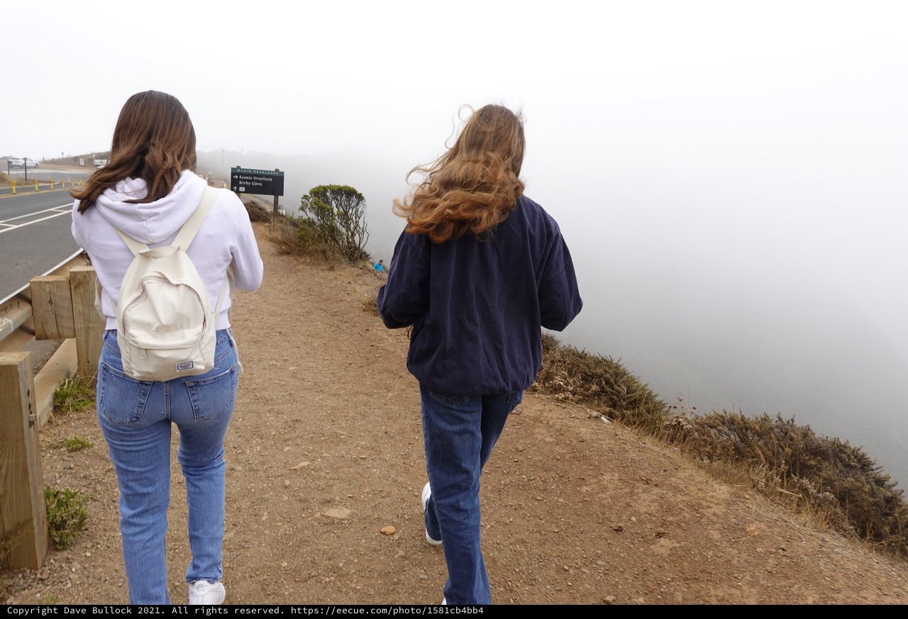 Two Women Walking in Coastal Fog