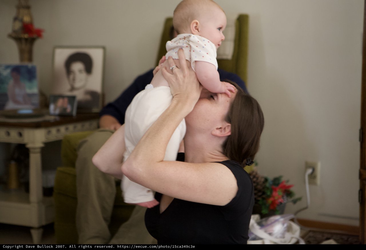 Mother Lifts Baby with Pure Joy and Love