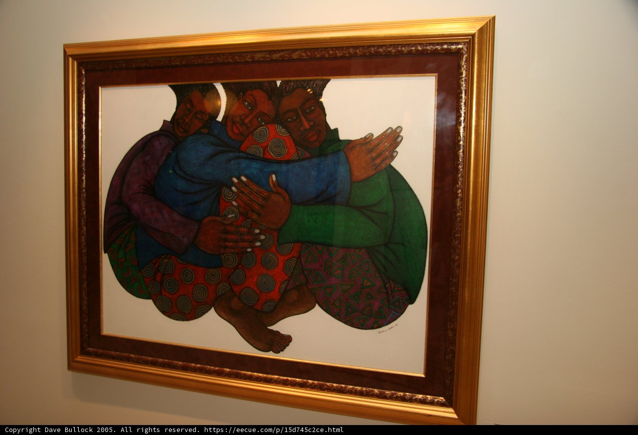 Three People Embracing