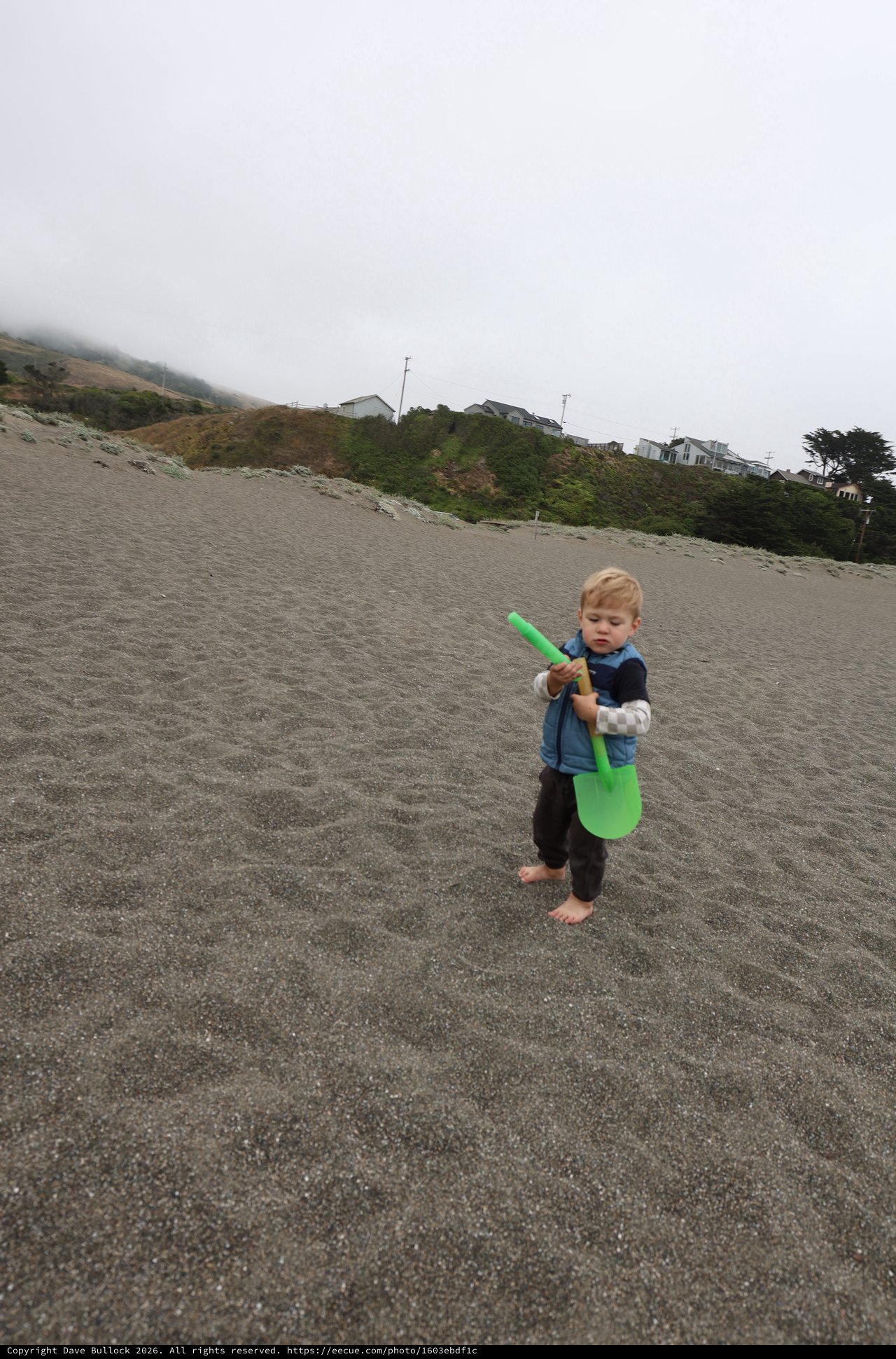 Barefoot Toddler Explores Foggy Pacific Beach