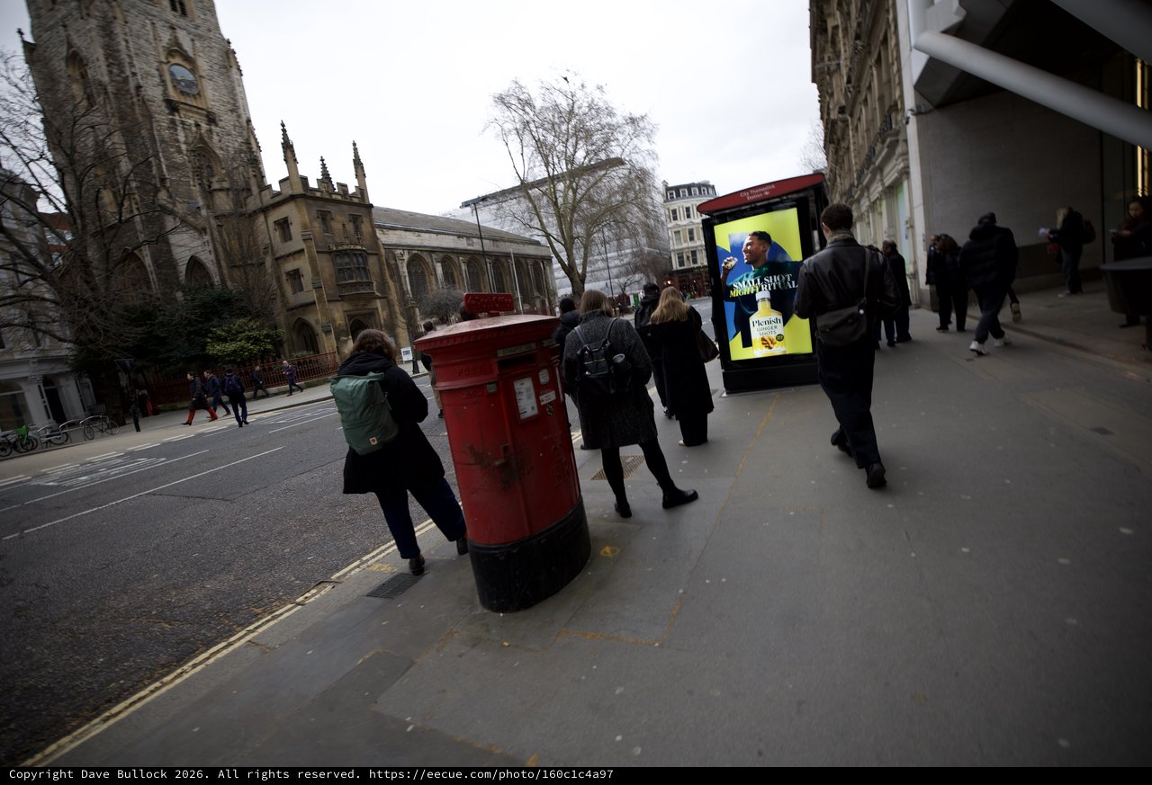 Urban Street Scene with Historic Church and Red Postbox