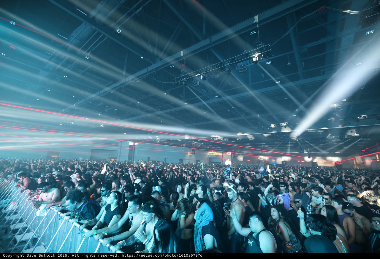 Massive Indoor EDM Festival Crowd Under Laser Light Show