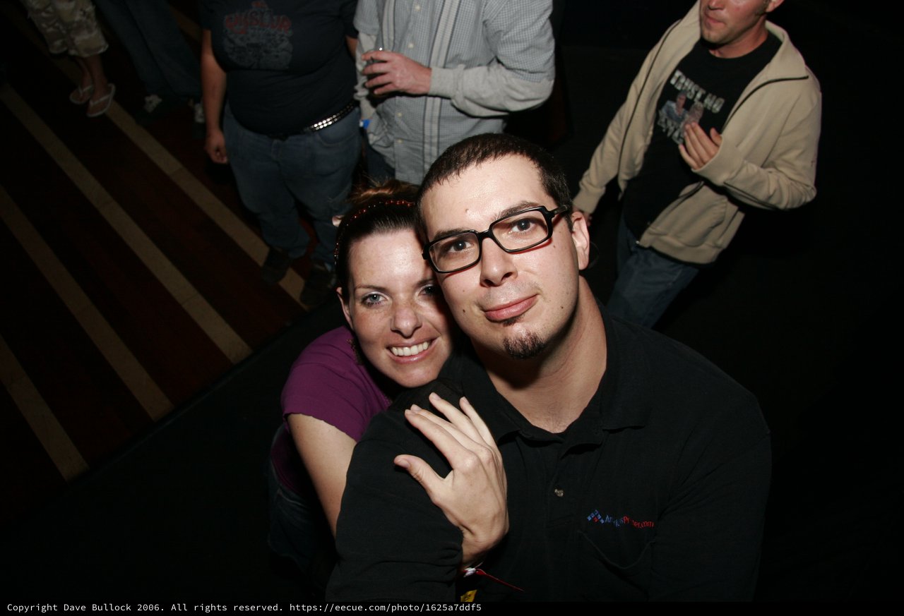 Dave and Penelope Pose at a Nighttime Event