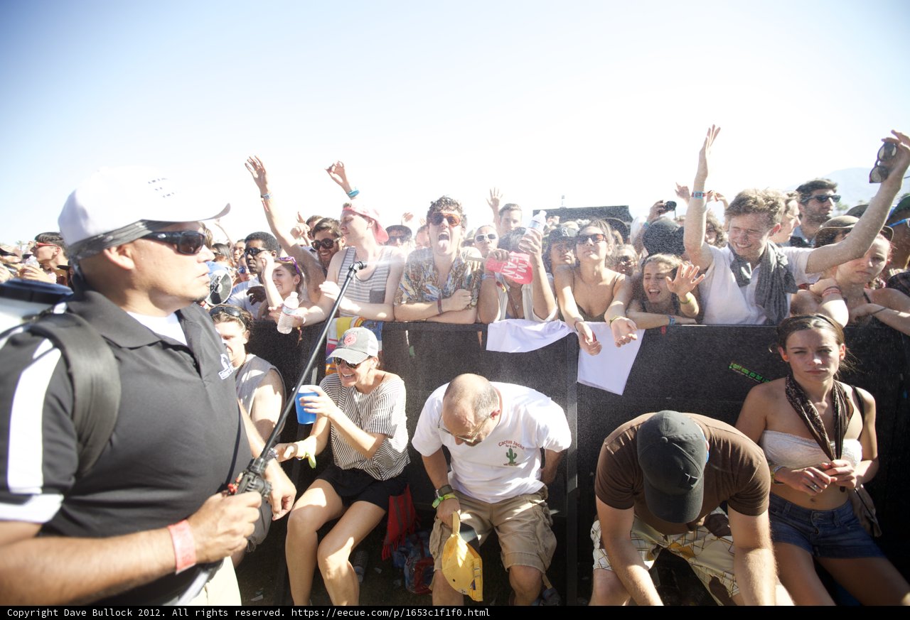 Man in Black Shirt and White Hat at Coachella 2012