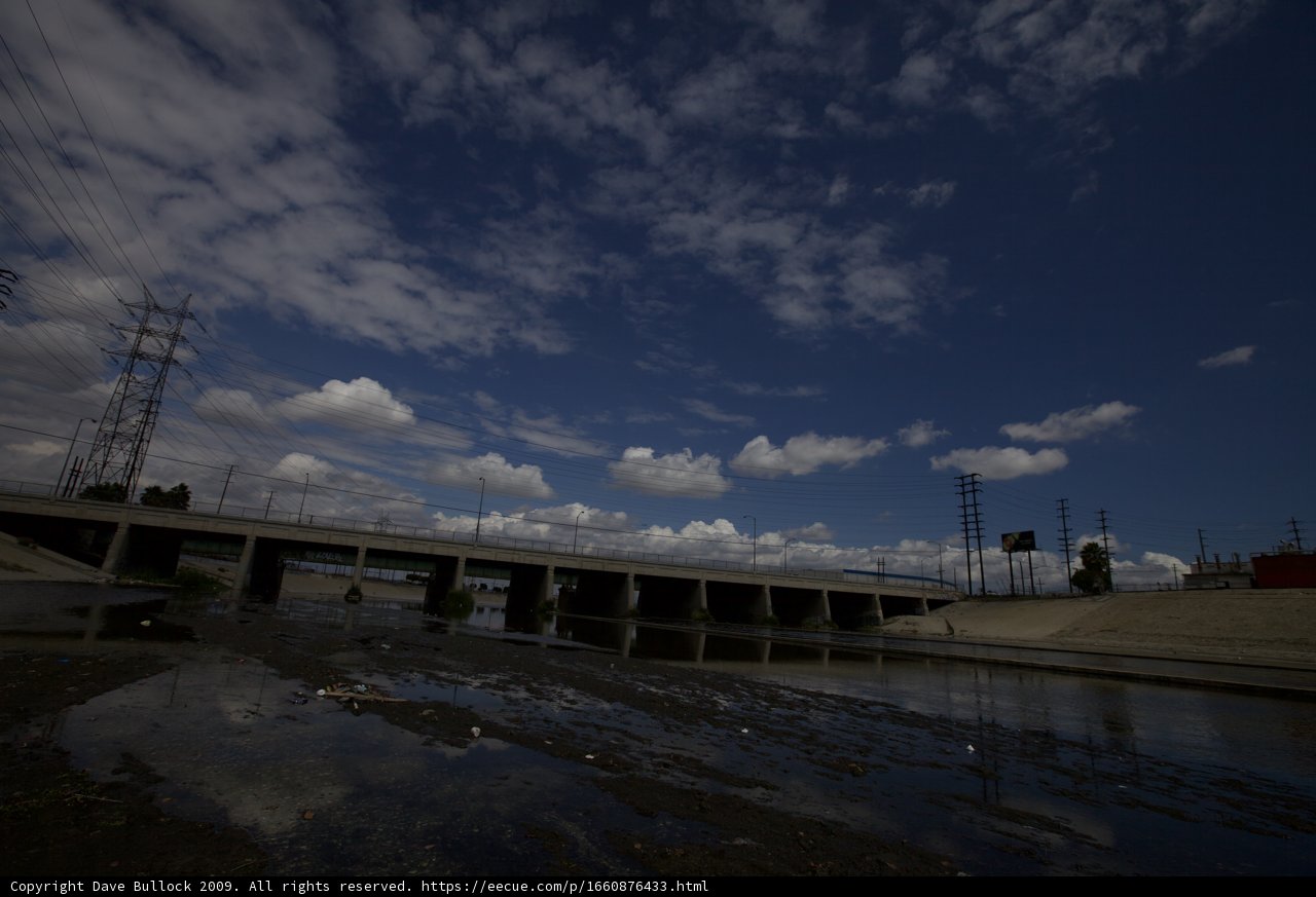 Overpass Bridge with Clouds and Power Lines