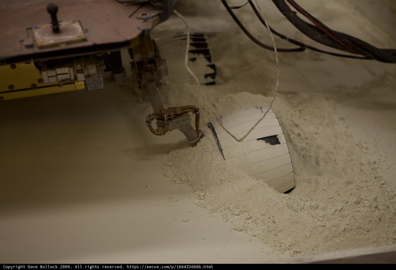 White ball in sandy surroundings