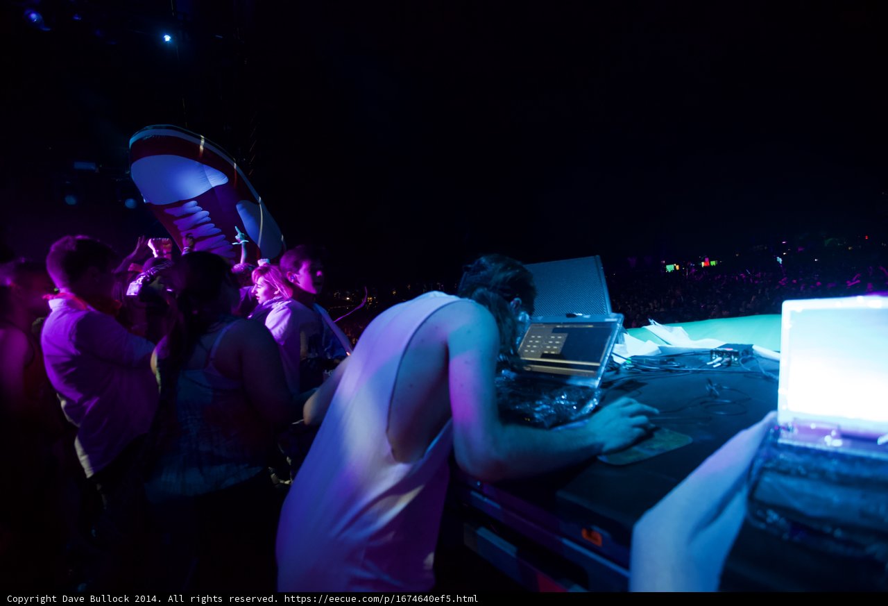 DJ with Laptops and Nightclub Lights
