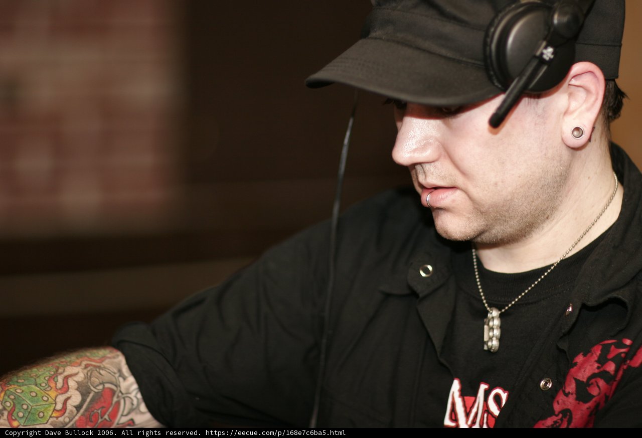 Tattooed Man in Black Shirt