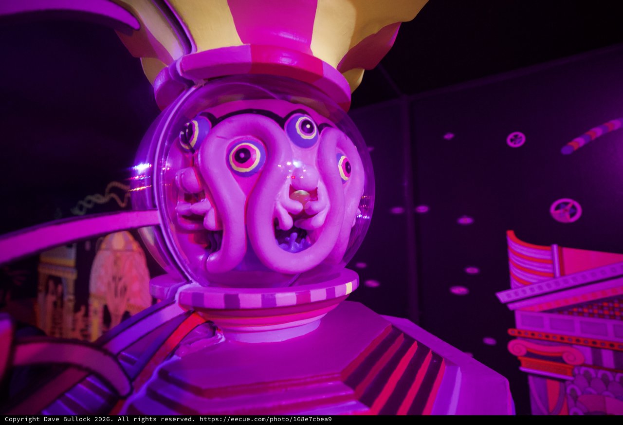 Surreal Purple-Lit Animatronic Rabbit Character in Dark Attraction
