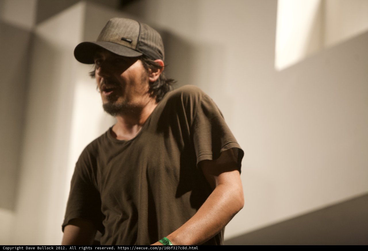 Smiling Amon Tobin in Baseball Cap
